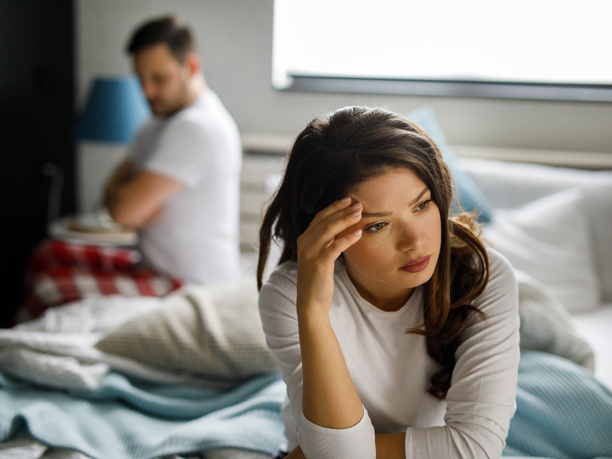 couple sitting on the bed