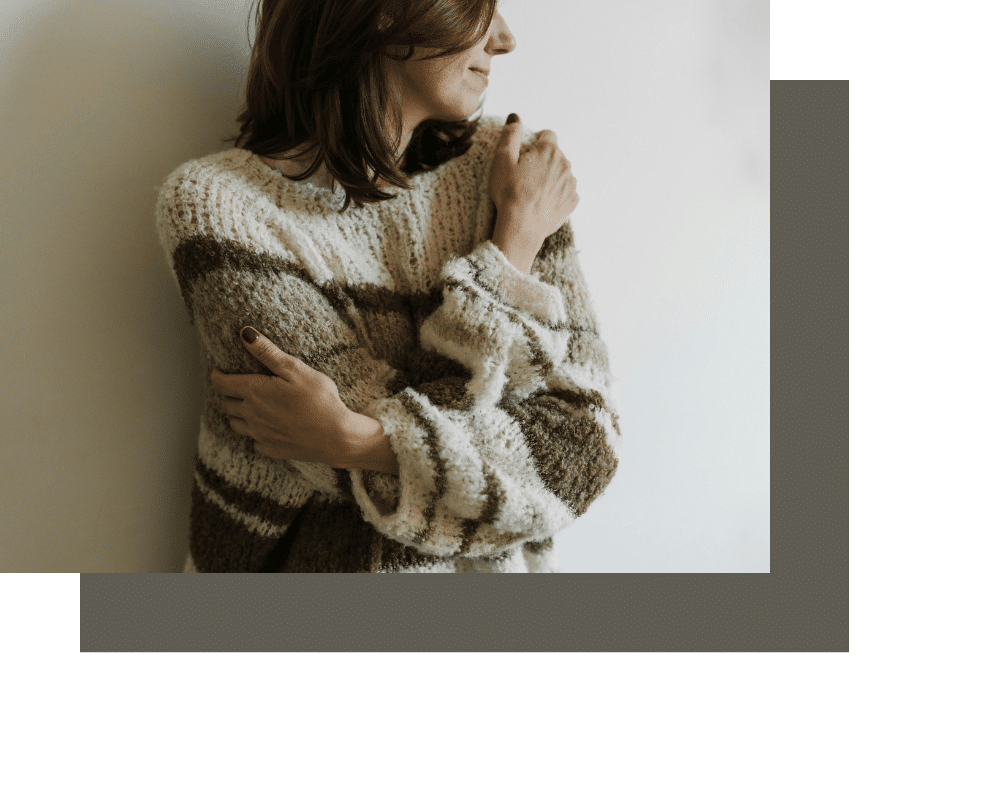 Person embracing herself after self esteem therapy