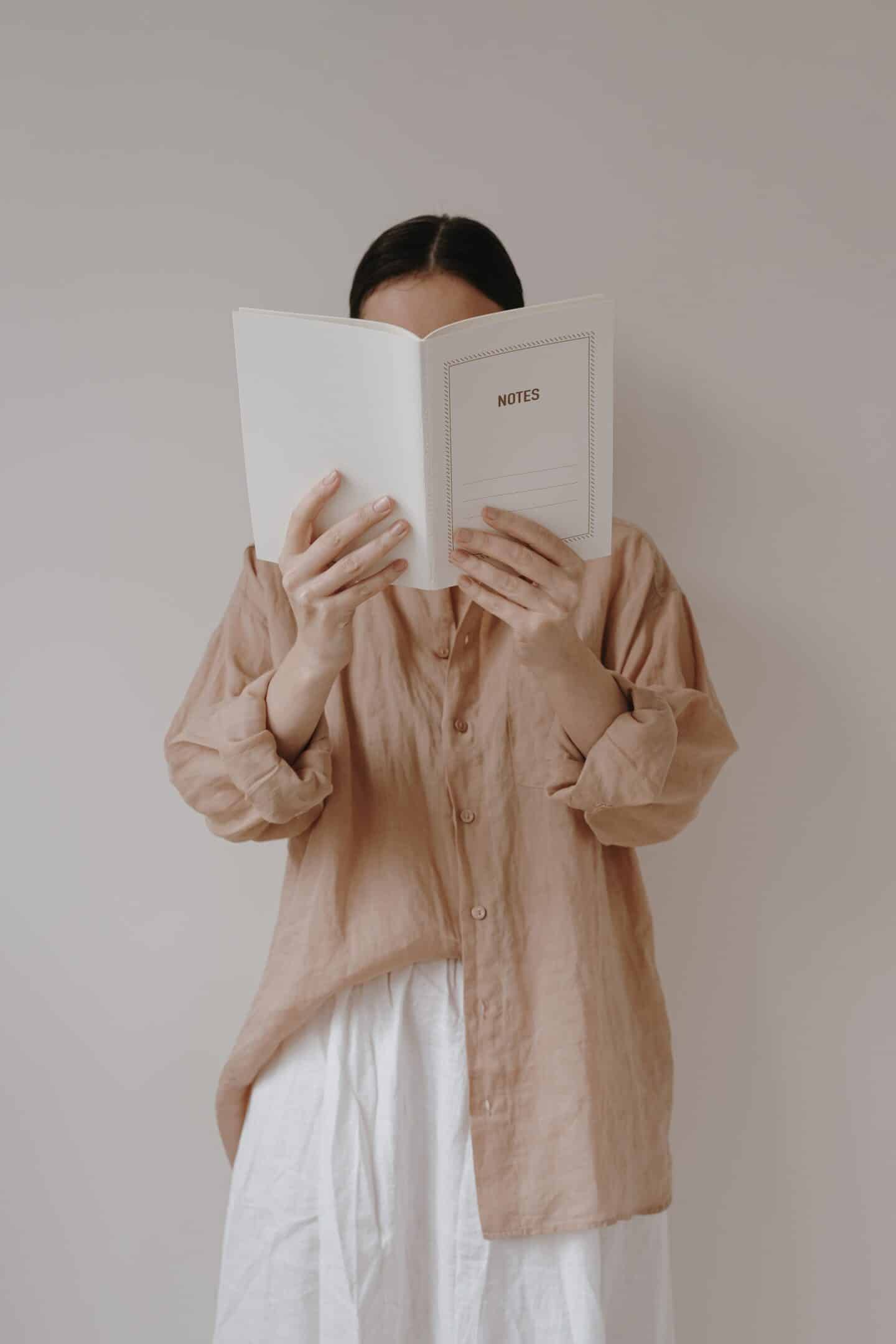 Person reading a book about Individual Therapy
